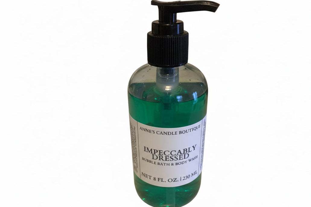 Bottle of bubble bath with a pump labeled 'Impeccably Dressed' on a white background