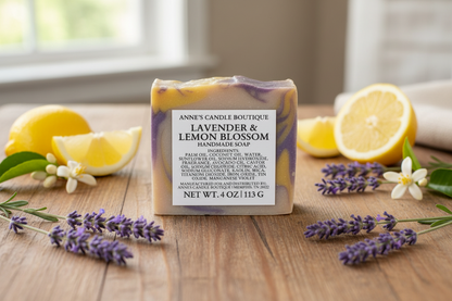 Bar of soap with lavender and lemon blossom scent on a wooden surface with lemons and lavender flowers.