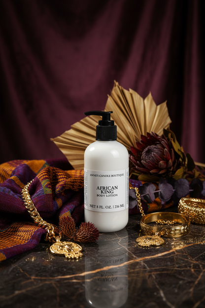 White bottle of 'African King' body lotion on a dark surface with decorative elements.